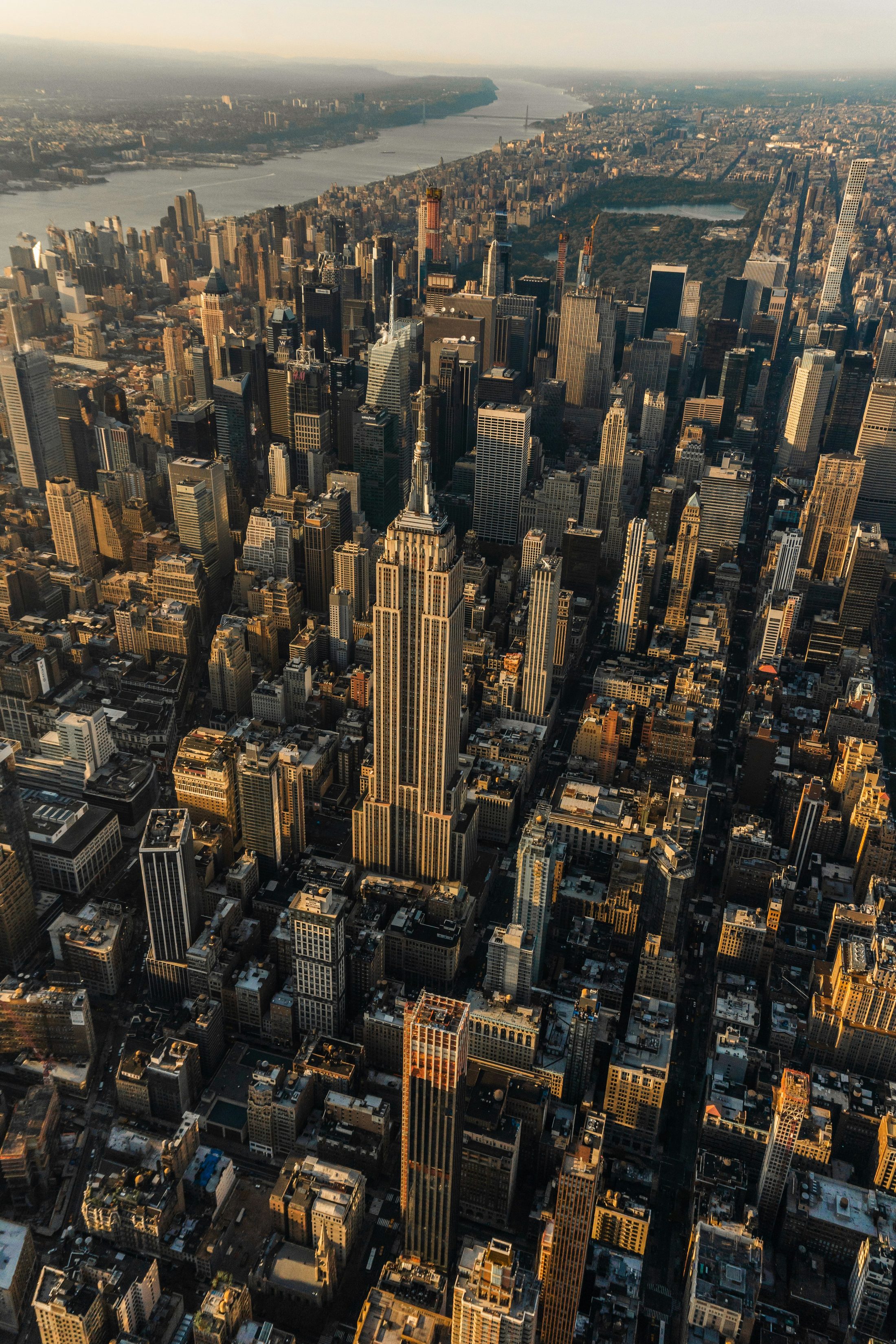 Aerial view of the Empire State Building and Manhattan skyline at golden hour